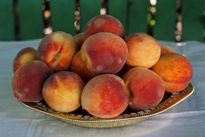 Close-up of fruits in basket on table