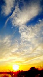 Low angle view of dramatic sky during sunset