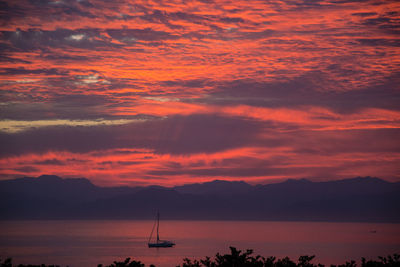 Scenic view of sea against orange sky