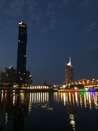 Illuminated buildings at waterfront