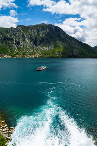 Scenic view of lake against cloudy sky