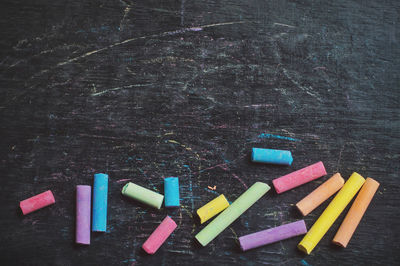Close-up of multi colored pencils on table