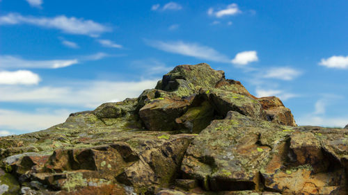 Low angle view of rock formations against sky
