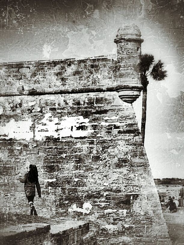 WOMAN STANDING IN OLD BUILDING