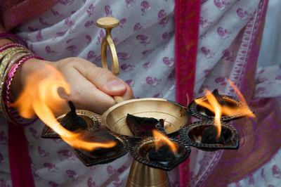 Cropped hand of woman preparing food