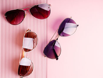 Close-up of sunglasses on table against gray background
