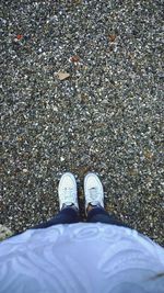 Low section of woman standing on tiled floor