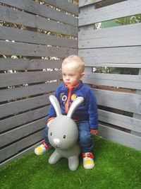 Full length of cute boy toy toys