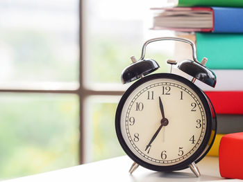Close-up of clock on table