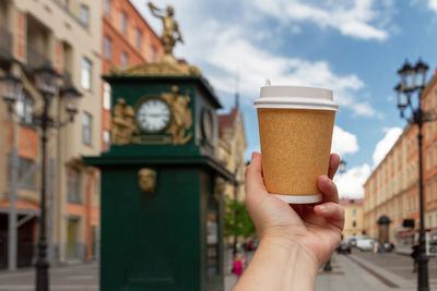 Cropped hand holding drink