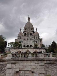 View of historic building against cloudy sky