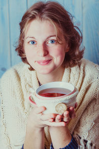 Portrait of woman drinking coffee