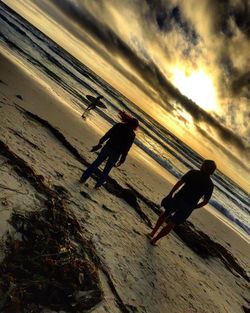 Scenic view of beach at sunset