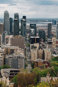 High angle view of buildings in city against sky