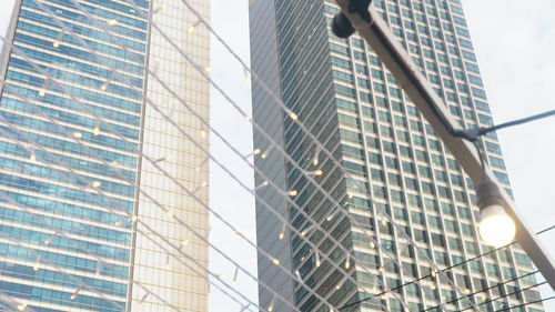 Low angle view of skyscrapers against sky