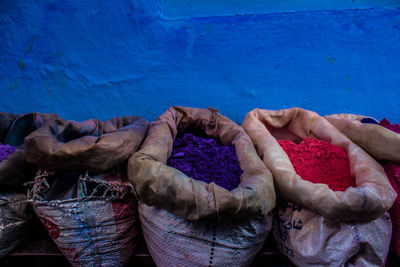 Powder paint against wall in sacks for sale