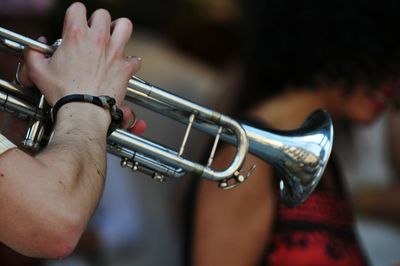 Cropped image of man playing trumpet