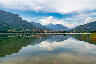 Scenic view of lake and mountains against sky