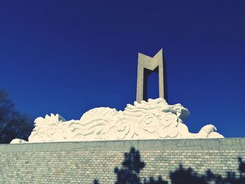 Low angle view of building against blue sky