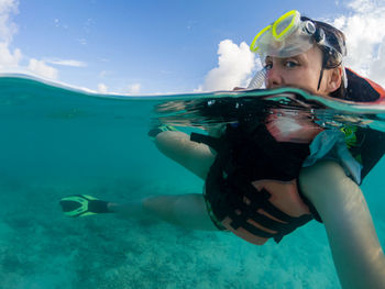 Portrait of woman swimming in sea