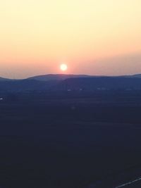 Scenic view of landscape at sunset