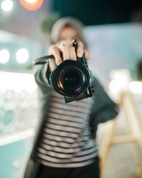 Portrait of woman photographing