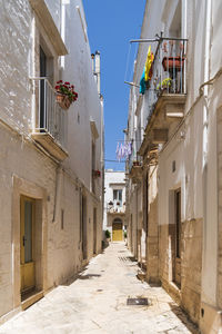 Narrow alley amidst buildings in town