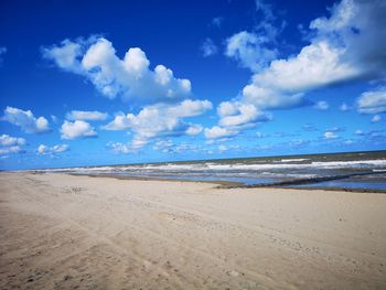 Scenic view of beach against sky