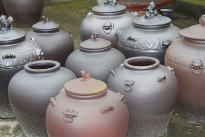 Close-up of pottery at market for sale