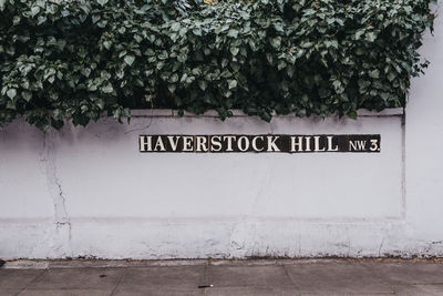 Information sign against wall