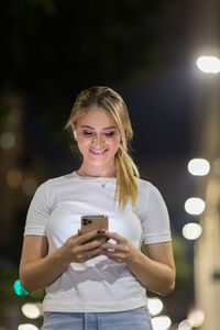 Young woman using mobile phone