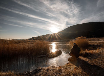 Scenic view of lake against sky during sunset