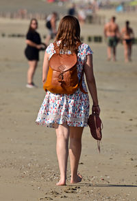 Young woman walking at beach