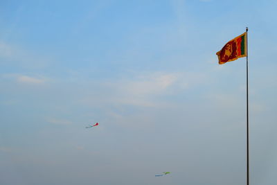 Low angle view of flag against sky