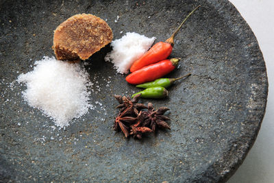 High angle view of chili peppers on rock