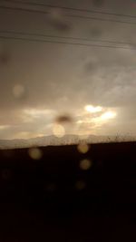 Silhouette landscape against sky during sunset