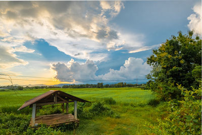 Built structure on field against sky