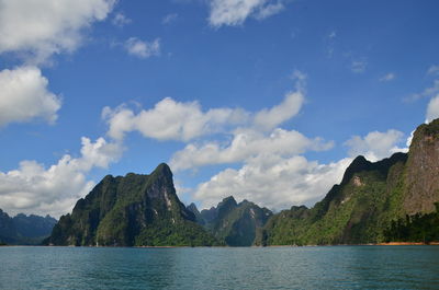 Scenic view of lake and mountains against sky