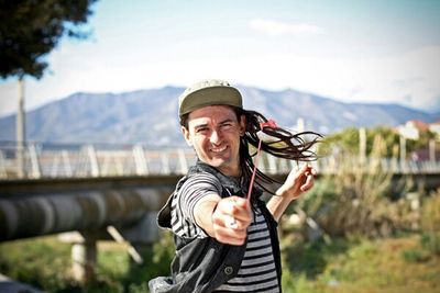 Portrait of a young man standing outdoors