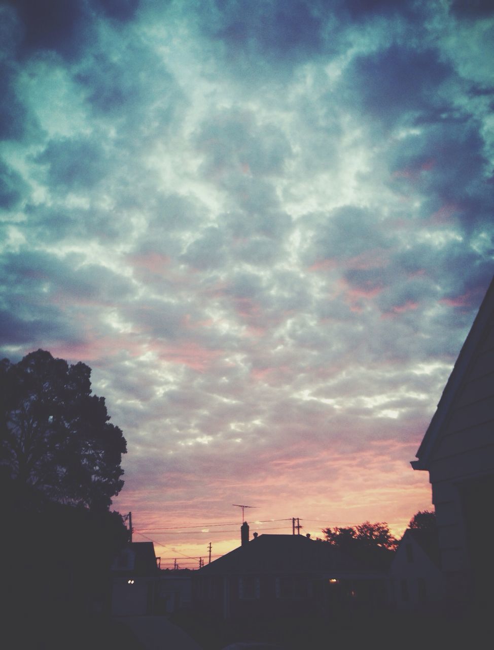 building exterior, architecture, built structure, sky, sunset, cloud - sky, silhouette, low angle view, house, cloudy, residential structure, cloud, residential building, tree, building, city, dusk, outdoors, nature, dramatic sky