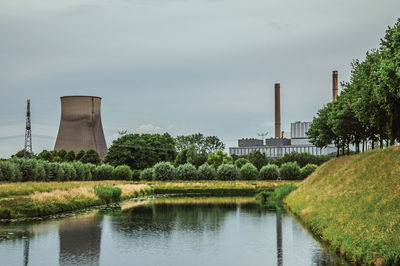 Canal and nuclear power plant near geertruidenberg. a small village in the netherlands countryside.