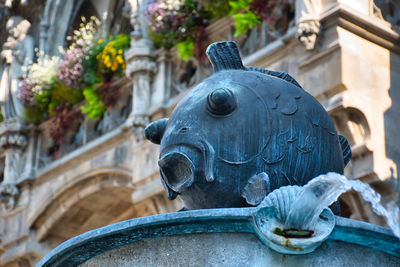 Close-up of statue against building