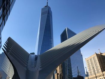 Low angle view of modern buildings against clear sky