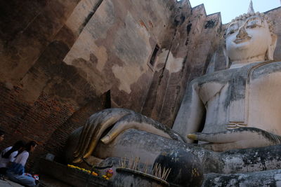 Panoramic view of statue against historic building