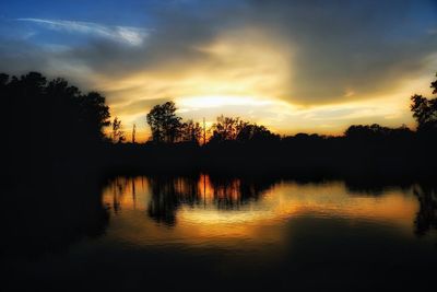 Scenic view of lake against sky during sunset