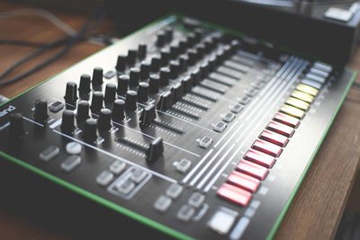 High angle view of sound recording equipment on table