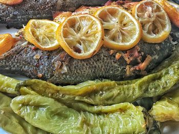 Close up shot of fish with lemon and pepper