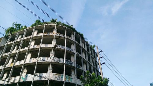 Low angle view of built structure against blue sky