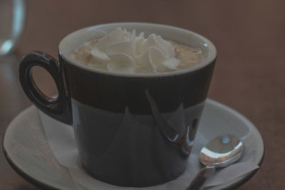 Close-up of coffee cup on table