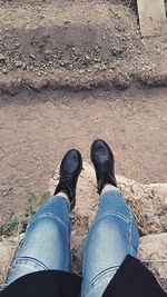 Low section of man standing on ground